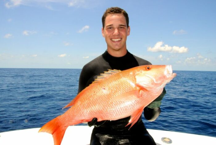 Mike Sipos Holding Red Fish