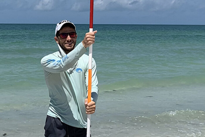 student monitoring beach erosion