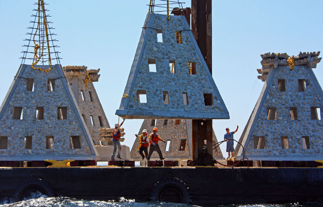 large artificial reefs being deployed from vessel