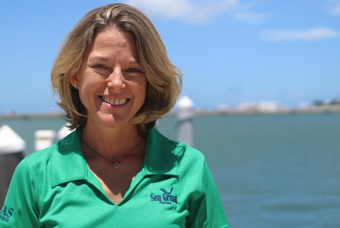 Extension Agent angela on pier smiling