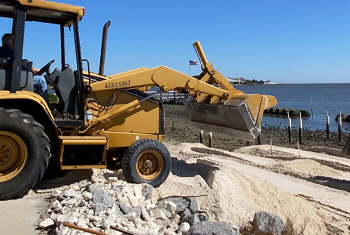bulldozer moving living shorelines materials