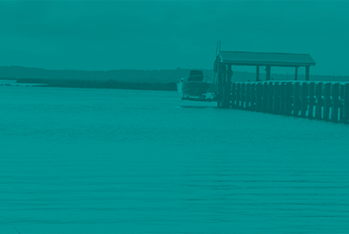 pier off the coast of florida with teal overlay