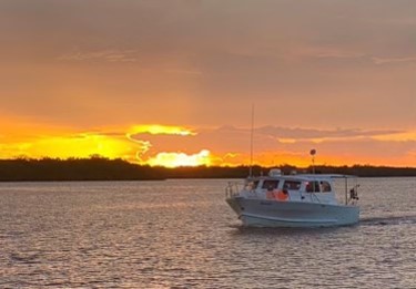 Sunset with boat on Pine Island