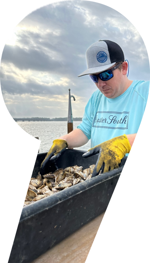 Thomas Derbes handling oysters