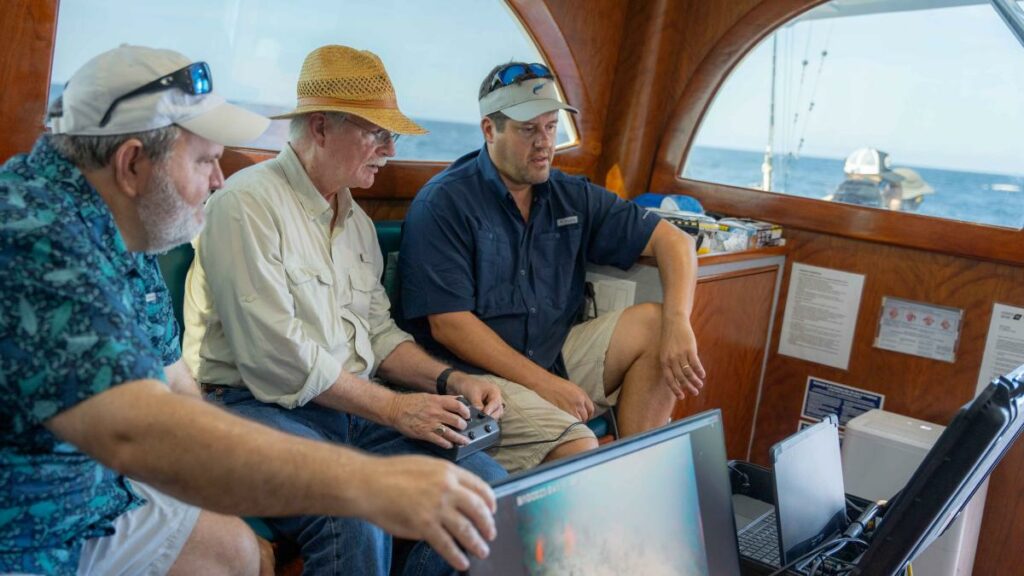 researcher Will Patterson, Congressman John Rutherford and researcher Joe Tarnecki