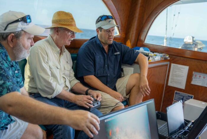 researcher Will Patterson, Congressman John Rutherford and researcher Joe Tarnecki