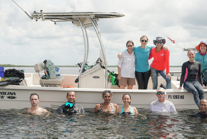 eyes on seagrass training team on boat in ocean