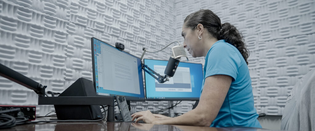 Ana Zangroniz recording at microphone and computer