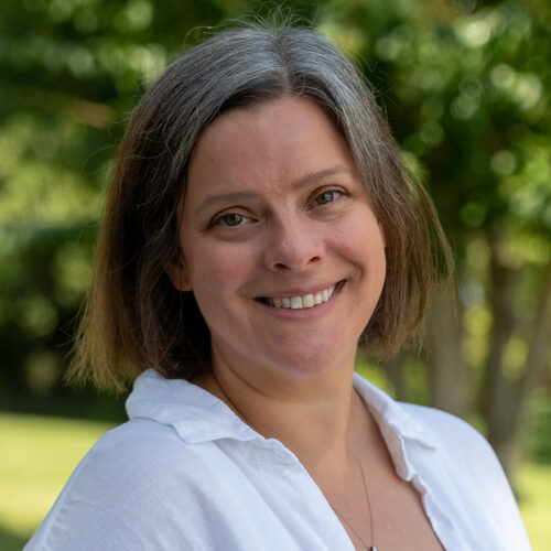 photo of Katie Lohr outside with greenery in background