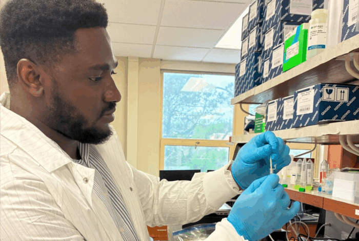 Samuel Kwawukume working in a Lab
