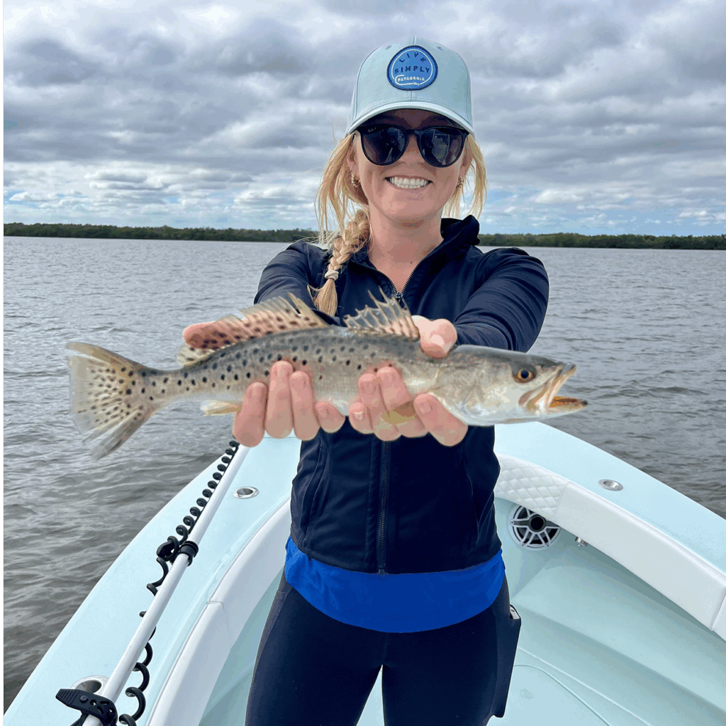 Repeta holding a Spotted seatrout