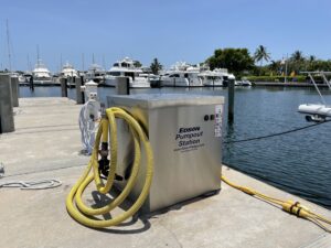 Pumpout station with hose assembly on a dock