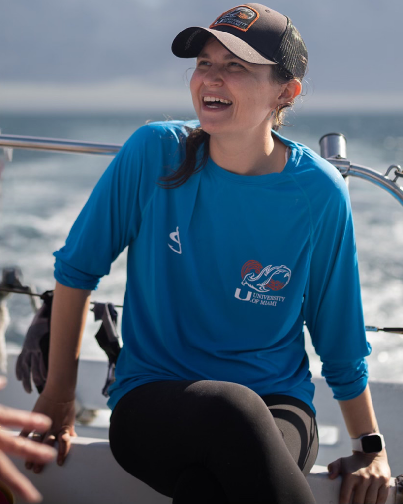 Julia Saltzman smiling while seated on a boat.