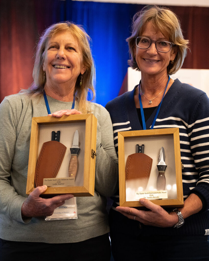 Leslie Sturmer and Dr. Sandra Brooke holding awards