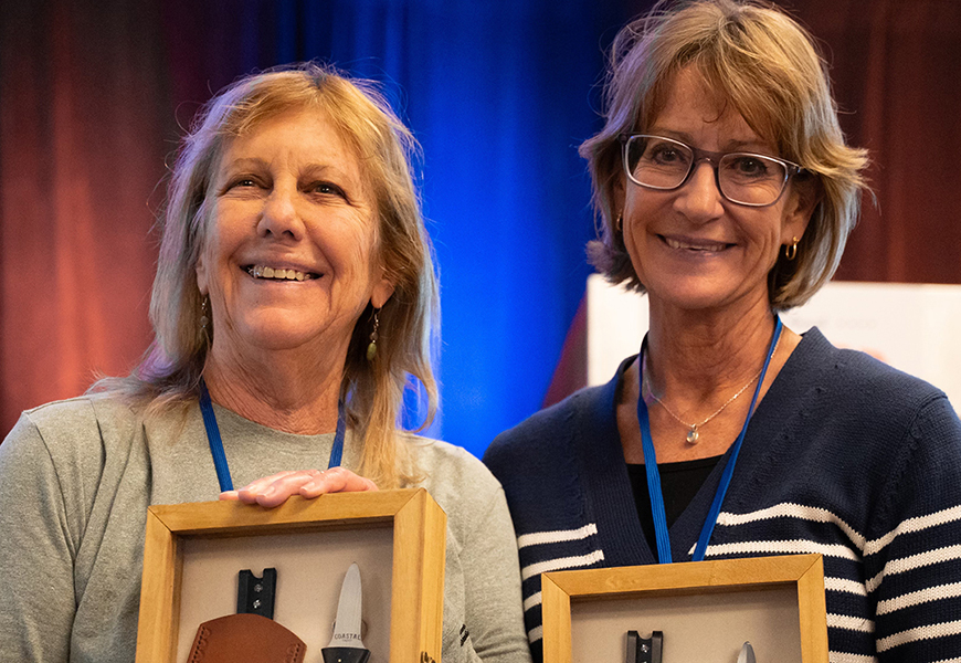 Leslie Sturmer and Dr. Sandra Brooke holding awards
