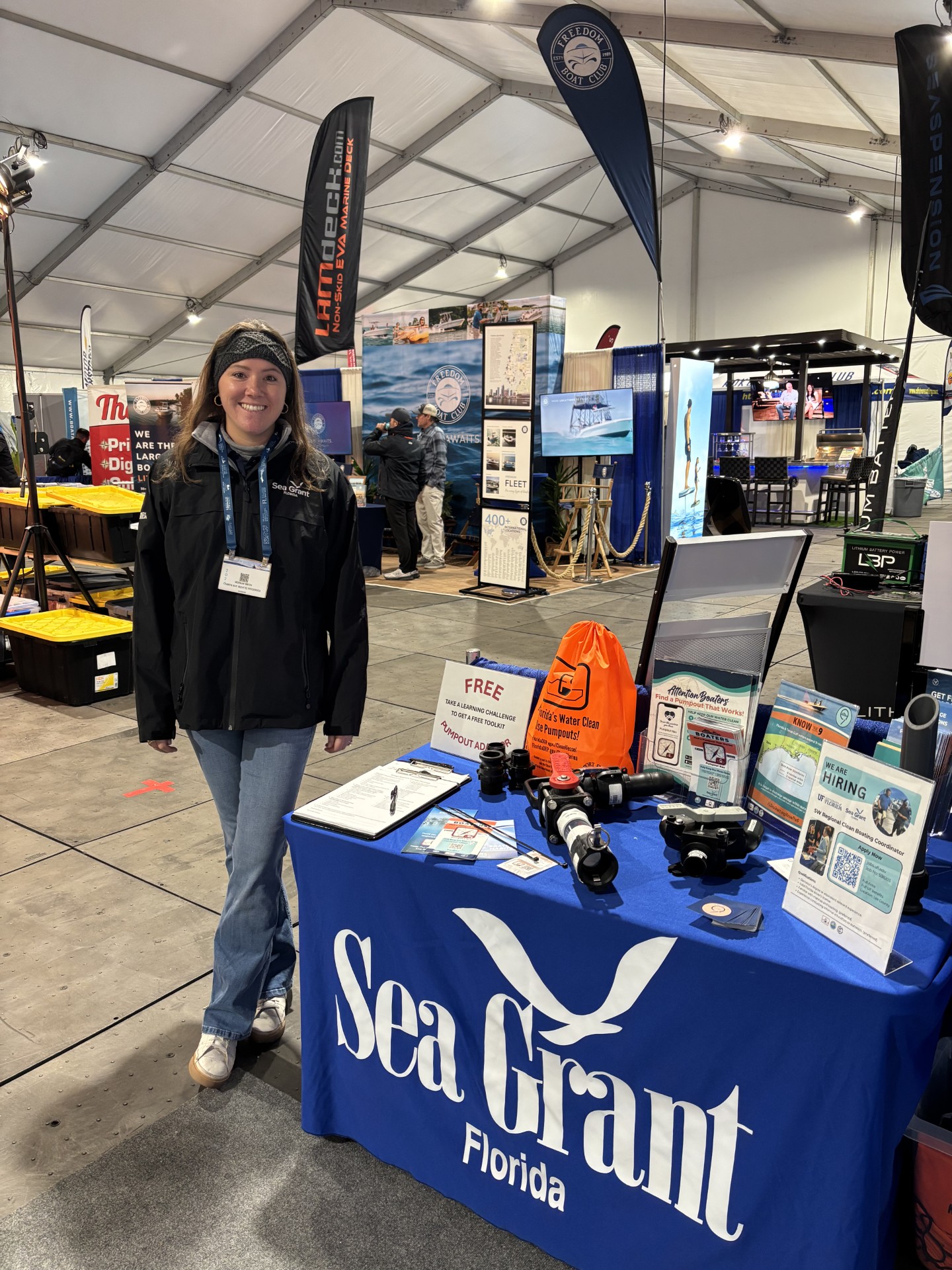 morgan smith next to a sea grant display table