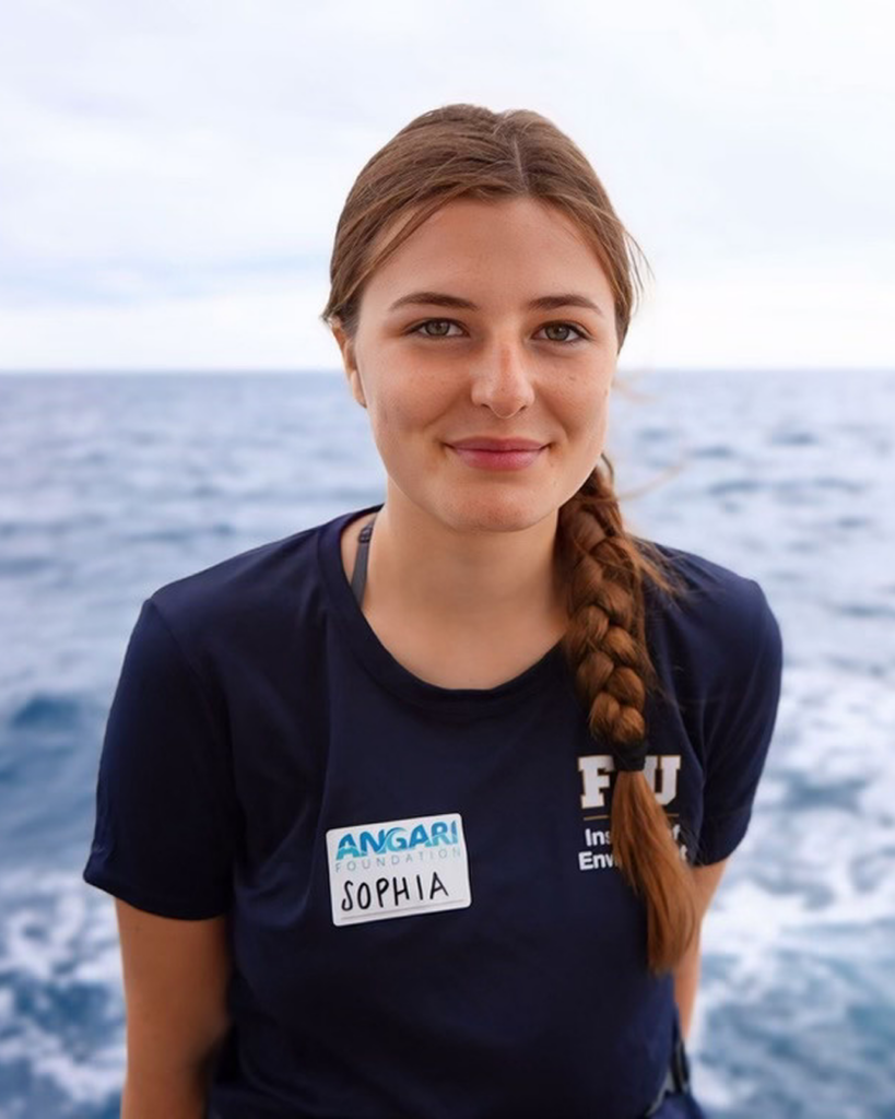 Sophia Hemsi smiling with the ocean in the background.