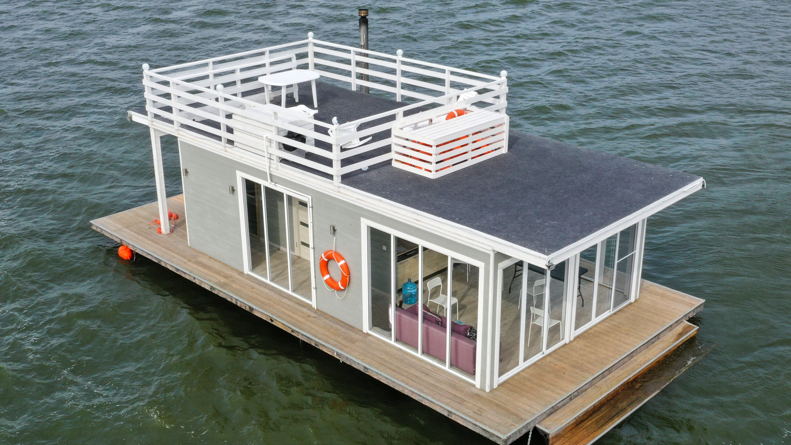 overhead view of a houseboat sitting stationary in the water