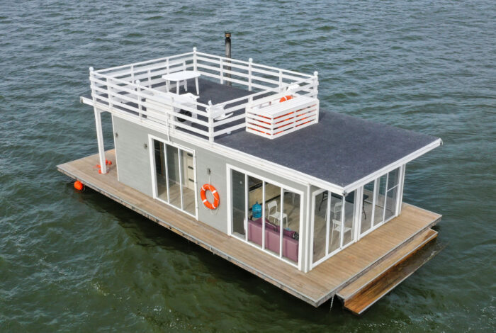 overhead view of a houseboat sitting stationary in the water